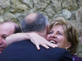 Cinda hugs Dick Snyder (neighbor)